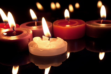 white, red and purple candles