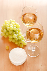 Still-life with bunch of grapes and white wine