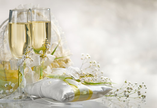 Two glasses filled with  champagne  with flowers