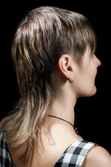Boyish short haircut of a young woman viewed from side