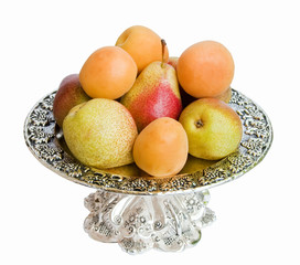 The dish with fruit isolated on a white background.