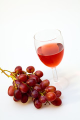 Wineglass witn grapes close up