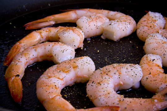 Shrimps close-up on frying-pan