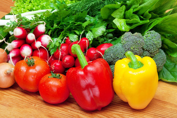 mix of fresh vegetables on wooden table