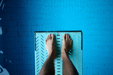 feet on diving board - 23753792