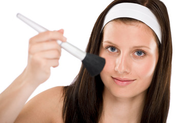 Obraz premium Beautiful woman holding make-up brush