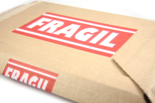 Cardboard box with Fragile on it, isolated on white