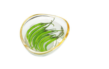 Fresh green chillies in water