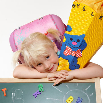 Cute blond girl has her first day at school