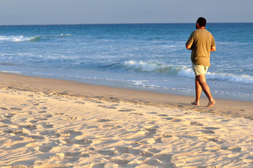 Man walking on the sand