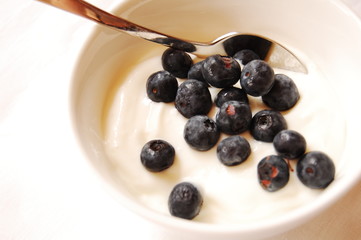 blueberries and yogurt with spoon