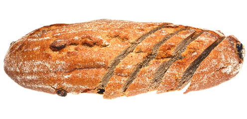 top view of sliced loaf of brown bread whith raisin and prunes