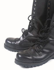 steel toe black leather boots on white background