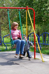 Boy and mother on pleasure-ground.