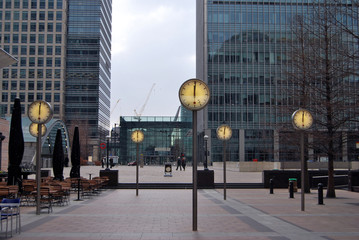 Canary Wharf, London, towards Grime Street showing clocks