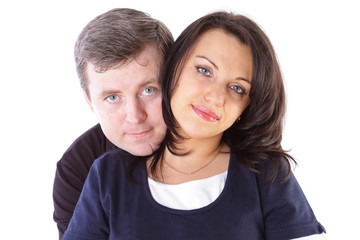 Mature couple smiling together over white