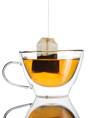Teabag in the cup with hot water