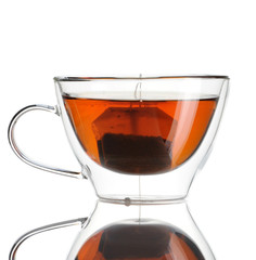 Teabag in the cup with hot water