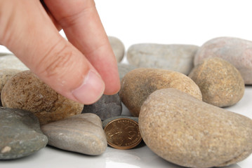 Fototapeta na wymiar coin in stones