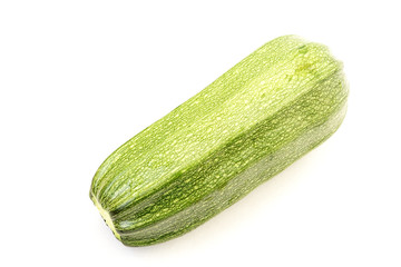 Single ripe green zucchini isolated on white