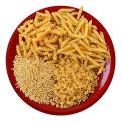 Red plate with four kinds of pasta. Italian food.