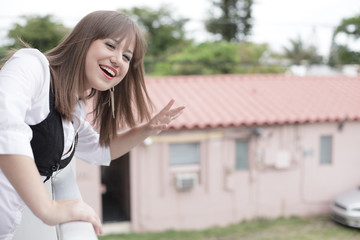 Woman waving and smiling