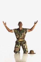 A Military Man With Arms In The Air And Looking Upwards