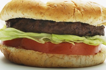 A Hamburger With Lettuce And Tomato