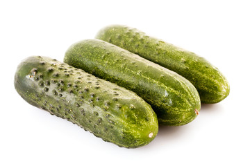 Three cucumbers isolated on white