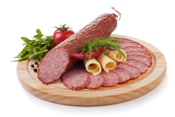 Sliced sausage with vegetables isolated