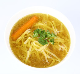 Chicken soup with macaroni and carrots and parsley