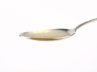 Chicken soup on a spoon