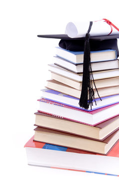 Student hat, diploma  and books -
