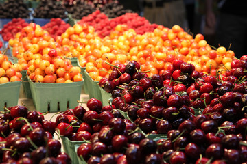 Berry pyramids piled up in a food market
