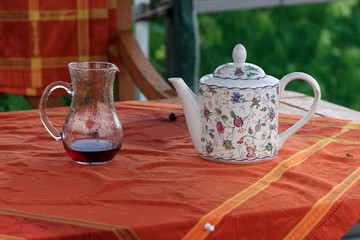 Carafe with juice and teapot