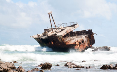 Aghullas shipwreck lying on the rocks in the breakers