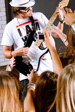 Guitarist performing for his adoring fans