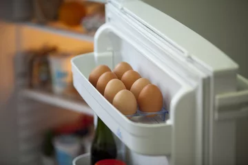 Tuinposter Eggs in the fridge © wellphoto