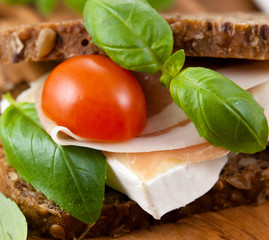 Sandwich with prosciutto crudo and brie