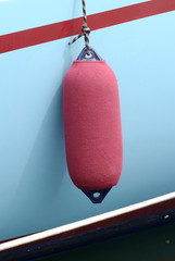 Cloth covered fender on boat in Cannes. France