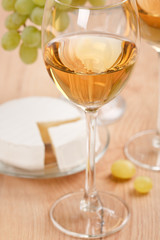 Still-life with bunch of grapes and white wine