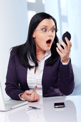 business women shocked about her own mirror image