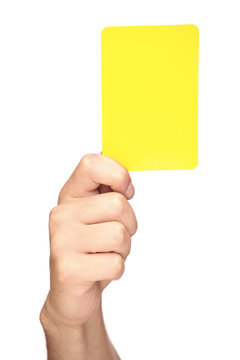 Hand holding a yellow card isolated on white