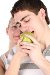 girl treats the young man with apple