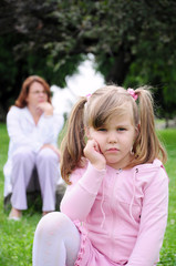 Girl with mom outdoors