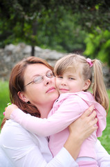 Girl with mom outdoors