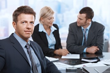 Portrait of businessman at meeting