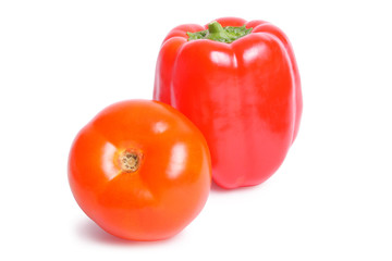 Tomato and pepper on white