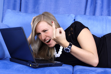 hard day - woman working with PC at home in sofa