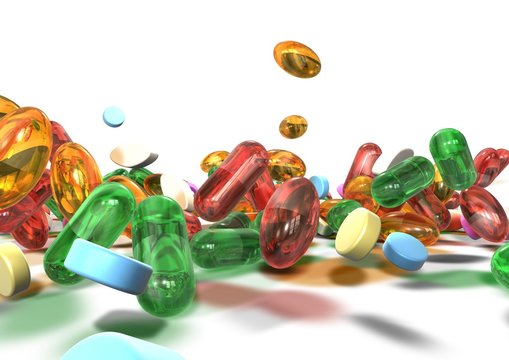 Close up of colorful pills over a white background